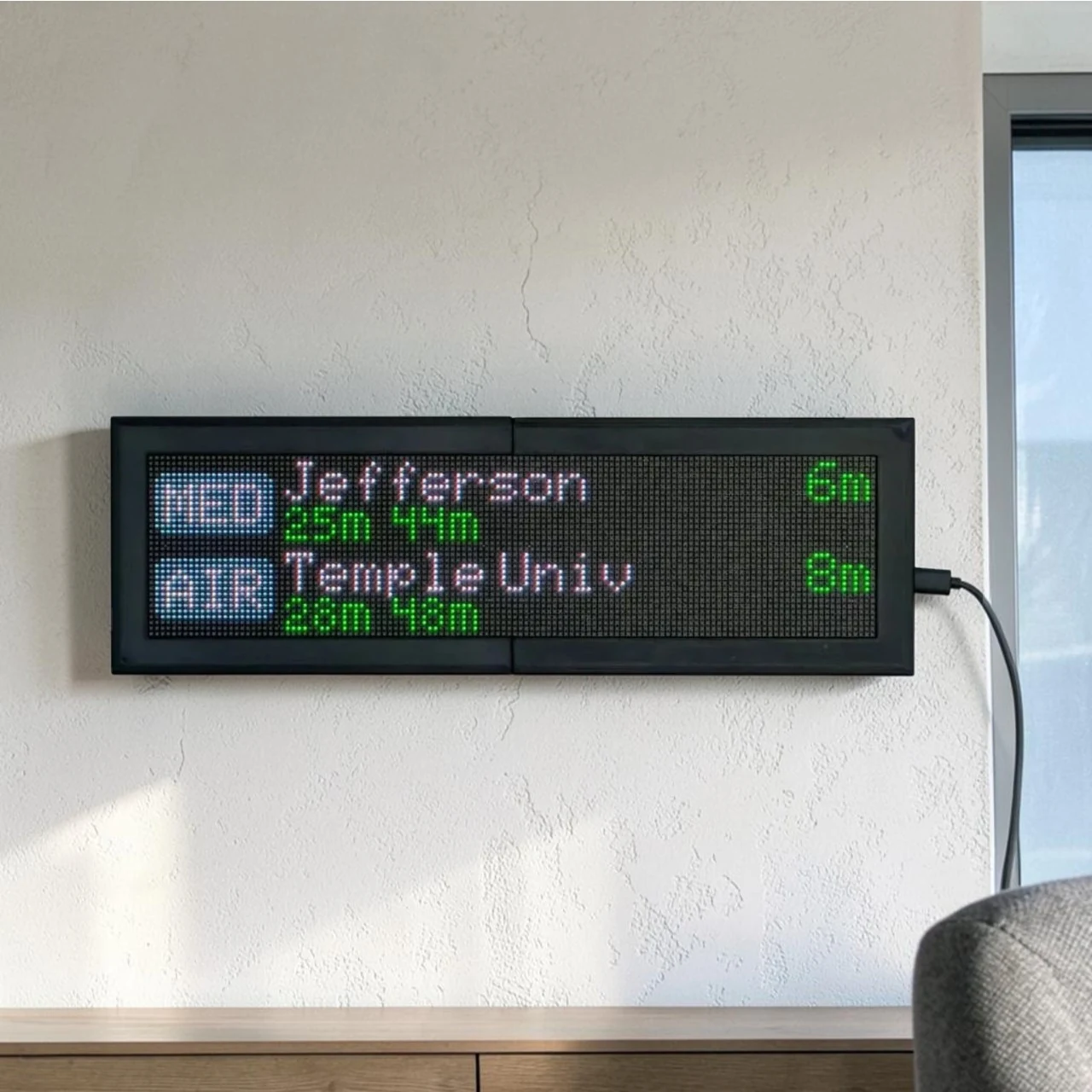 CommuteLive display wall-mounted showing SEPTA arrivals