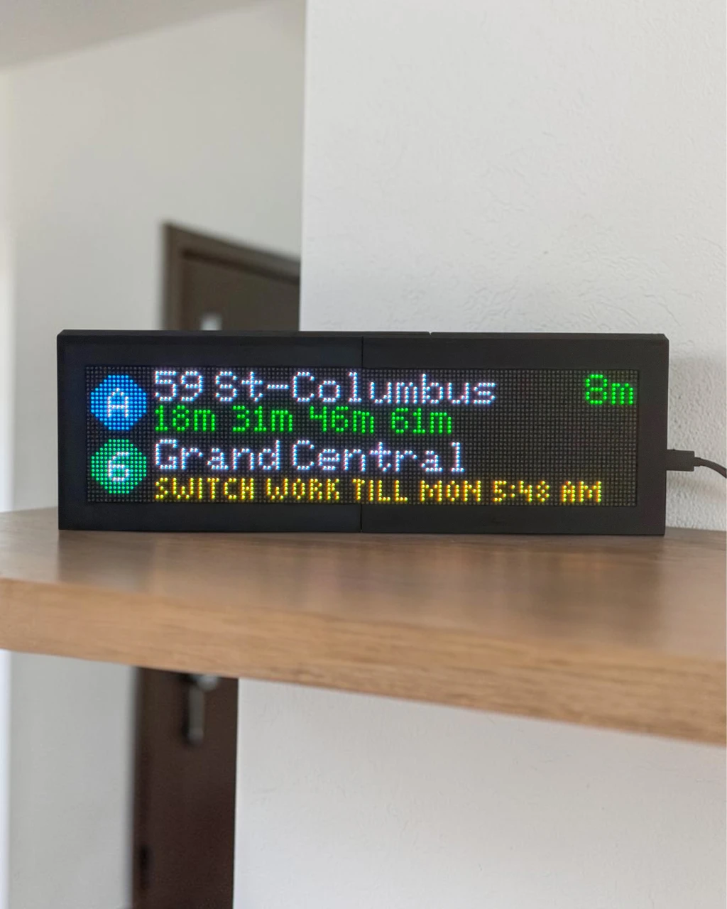 CommuteLive LED board showing a service alert scrolling on the board
